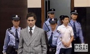 Gu Kailai being taken into court, August 2012